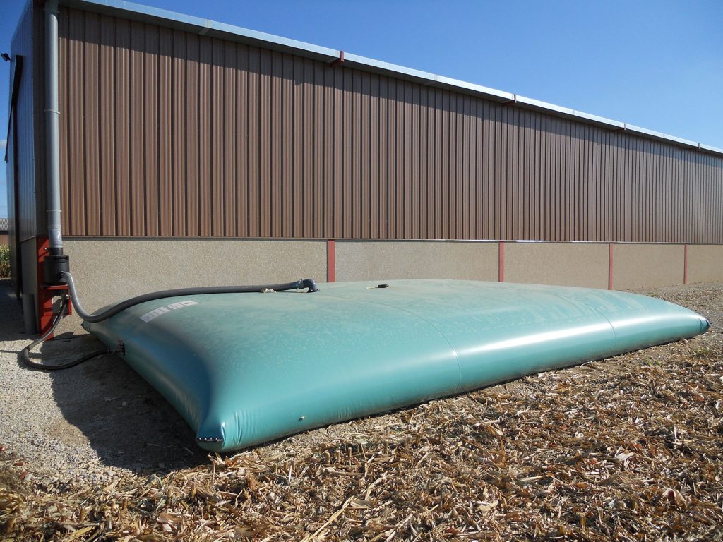A water bladder that is gravity fed from a roof to store water for commercial use